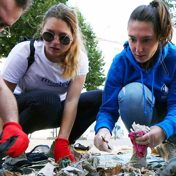 Employees picking up litter